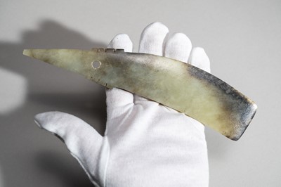 Lot 793 - A CELADON AND RUSSET QI JADE BLADE, QIJIA CULTURE