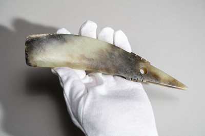 Lot 793 - A CELADON AND RUSSET QI JADE BLADE, QIJIA CULTURE