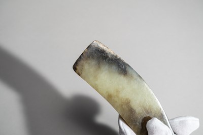 Lot 793 - A CELADON AND RUSSET QI JADE BLADE, QIJIA CULTURE