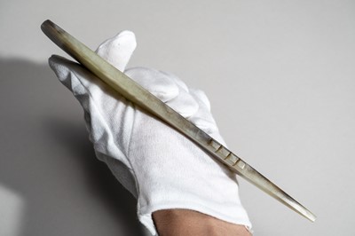 Lot 793 - A CELADON AND RUSSET QI JADE BLADE, QIJIA CULTURE