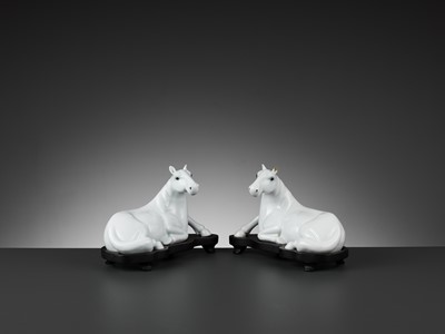 Lot 595 - A PAIR OF WHITE-GLAZED FIGURES OF HORSES, QING DYNASTY