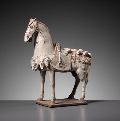 Lot 374 - A PAINTED POTTERY FIGURE OF A CAPARISONED HORSE, EASTERN WEI DYNASTY