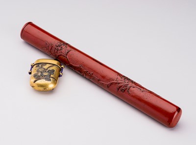 Lot 1617 - A CINNABAR LACQUERED WOOD AND BRASS YATATE, MEIJI