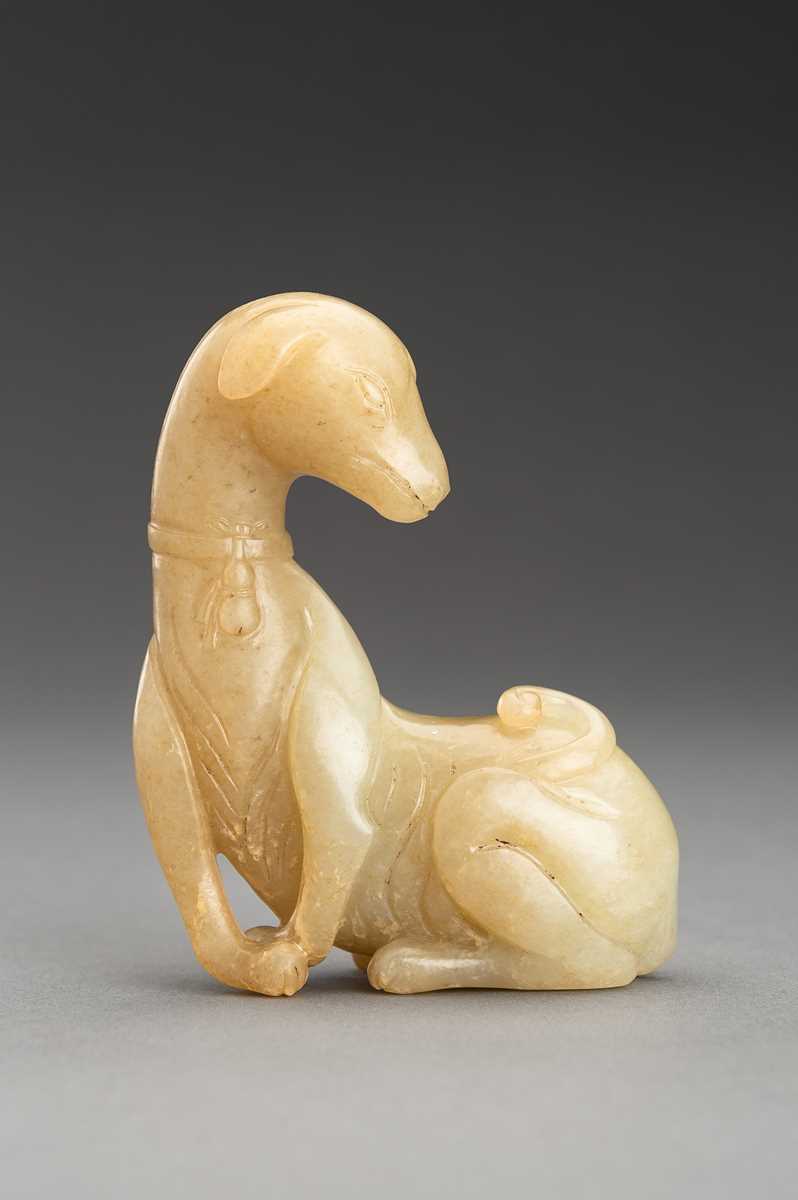 Lot 141 - A PALE YELLOW JADE FIGURE OF A DOG, QING