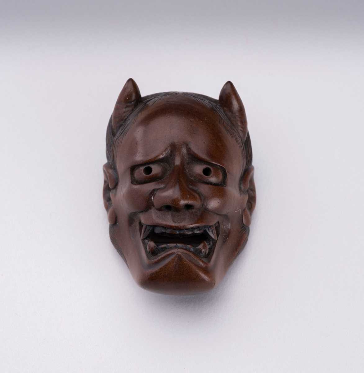 Lot 1510 - NAOAKI: A BOXWOOD MASK NETSUKE OF HANNYA
