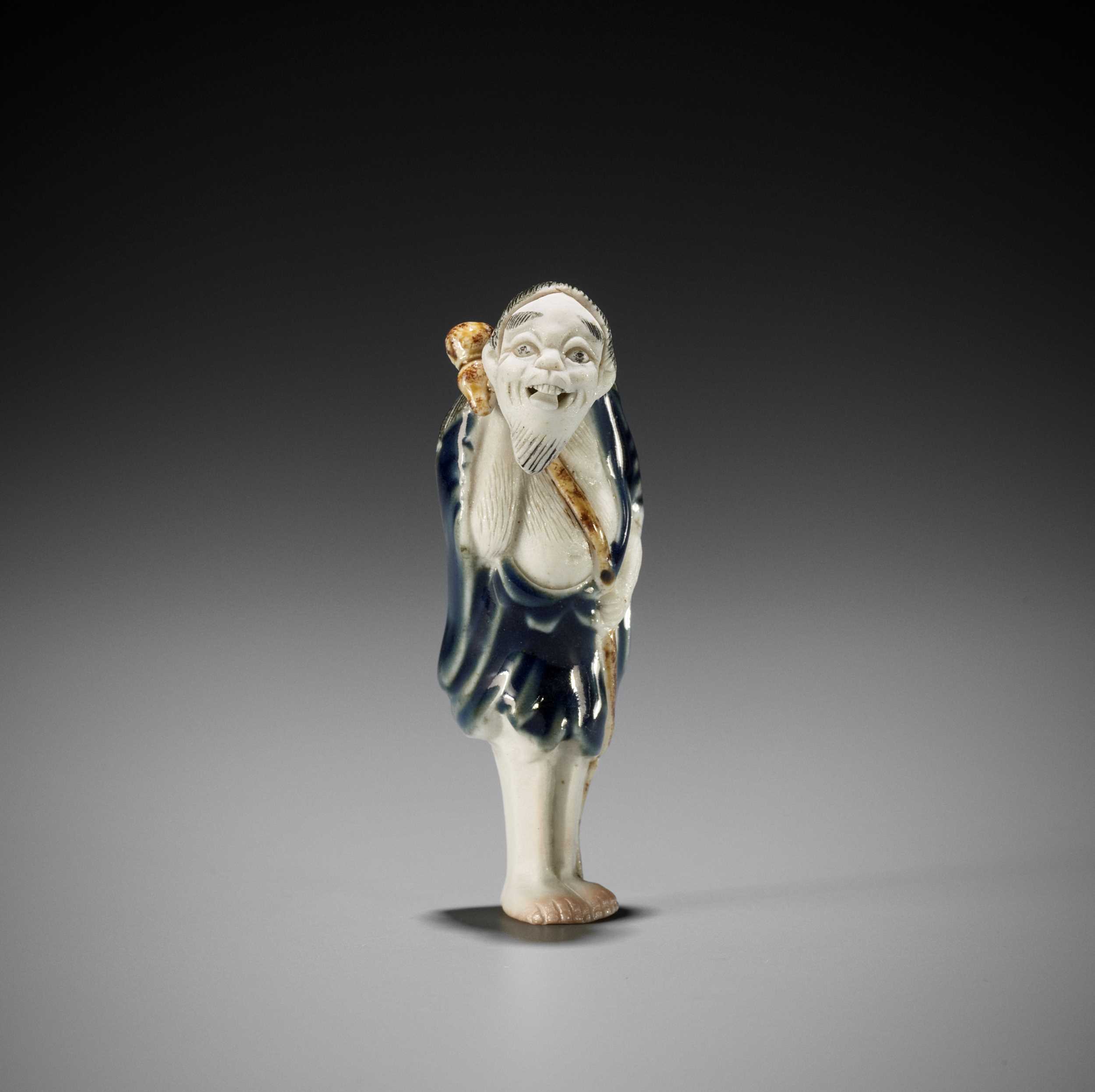 Lot 273 A HIRADO PORCELAIN NETSUKE OF TEKKAI SENNIN lot-273-a-hirado-porcelain-netsuke-of-tekkai-sennin