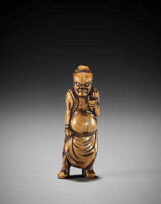 A RARE AND EARLY STAG ANTLER NETSUKE OF A NIO GUARDIAN
