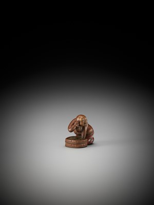 Lot 54 - A RARE AND HUMOROUS WOOD AND NEGORO LACQUER NETSUKE OF HOTEI TAKING A BATH