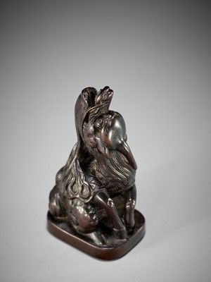 Lot 1416 - A FINE WOOD NETSUKE OF A BAYING KIRIN IN THE STYLE OF MITSUHARU