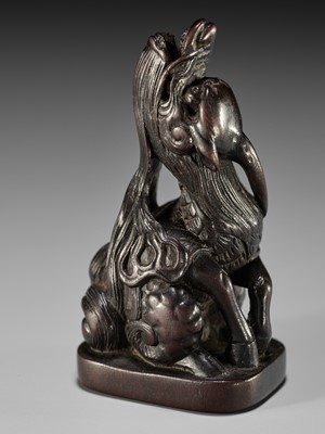 Lot 1416 - A FINE WOOD NETSUKE OF A BAYING KIRIN IN THE STYLE OF MITSUHARU