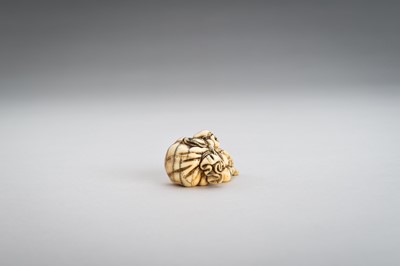 Lot 374 - AN IVORY NETSUKE OF HOTEI WITH HIS TREASURE BAG