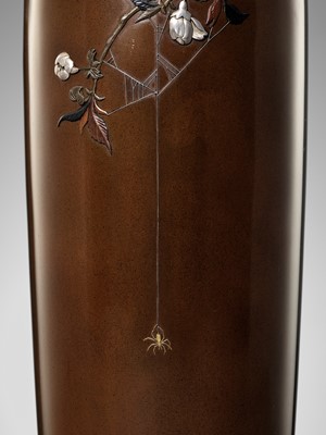 Lot 62 - OTSUEI FOR THE NOGAWA COMPANY: A MASTERFUL INLAID BRONZE VASE DEPICTING A SPIDER HANGING FROM A PLUM BRANCH