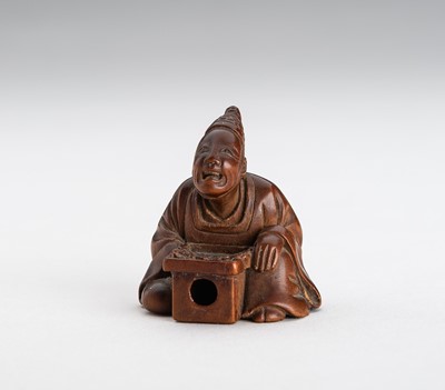 Lot 641 - A FINE WOOD NETSUKE OF A TEMPLE SERVANT