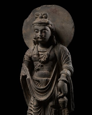 Lot 241 - A LARGE SCHIST FIGURE OF MAITREYA WITH ATLAS, ANCIENT REGION OF GANDHARA