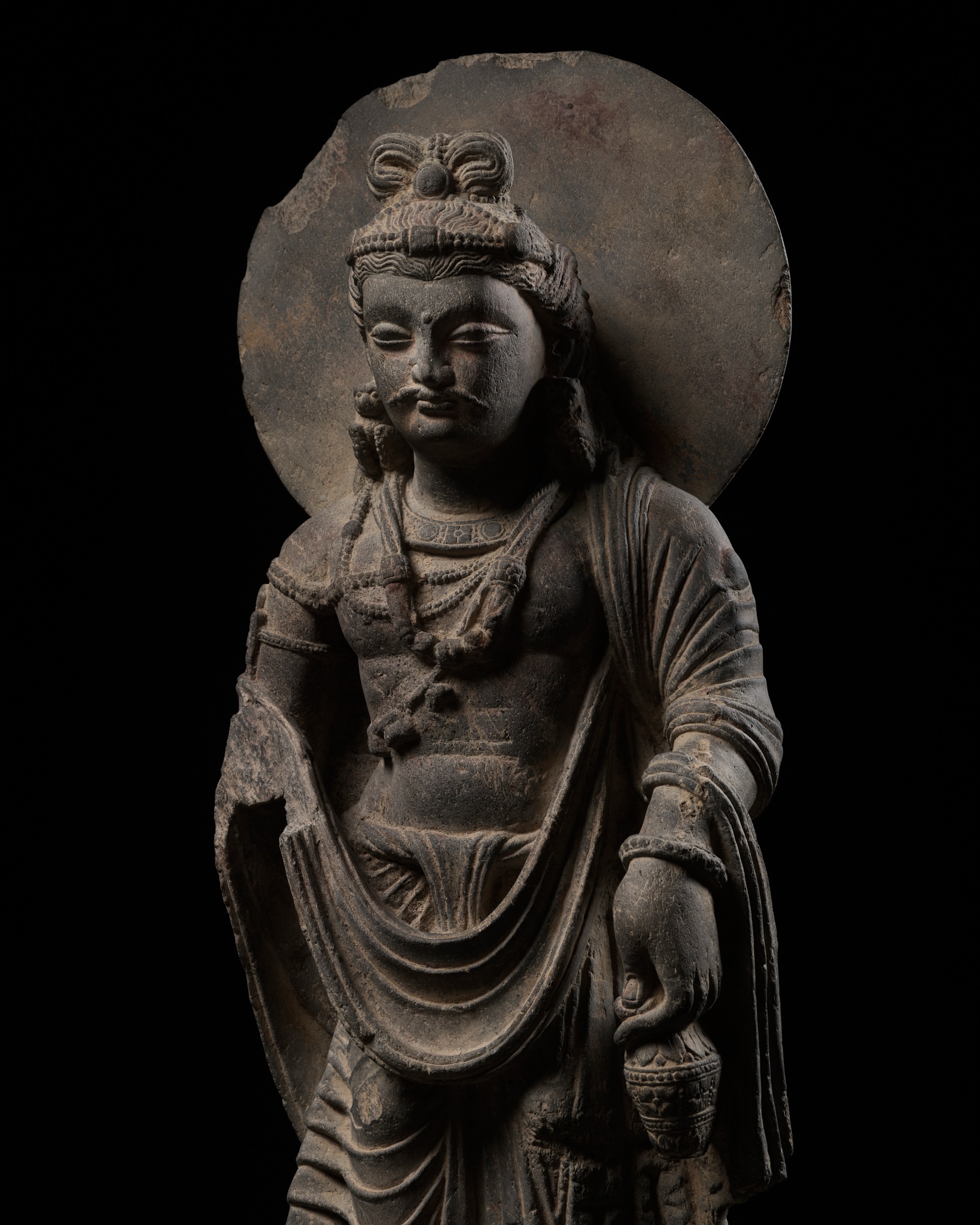 Lot 241 - A LARGE SCHIST FIGURE OF MAITREYA WITH ATLAS,