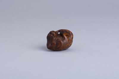 Lot 333 - MASANAO: A WOOD NETSUKE OF A SNARLING TIGER, EDO PERIOD
