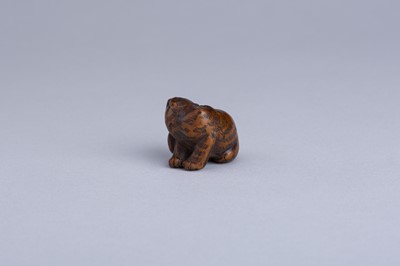 Lot 333 - MASANAO: A WOOD NETSUKE OF A SNARLING TIGER, EDO PERIOD