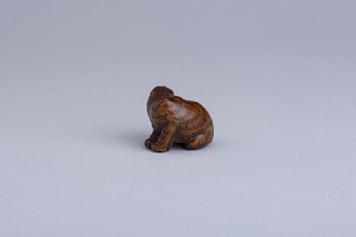 Lot 333 - MASANAO: A WOOD NETSUKE OF A SNARLING TIGER, EDO PERIOD