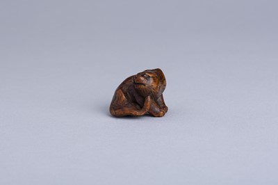 Lot 333 - MASANAO: A WOOD NETSUKE OF A SNARLING TIGER, EDO PERIOD