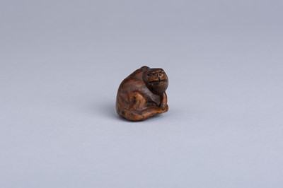 Lot 333 - MASANAO: A WOOD NETSUKE OF A SNARLING TIGER, EDO PERIOD