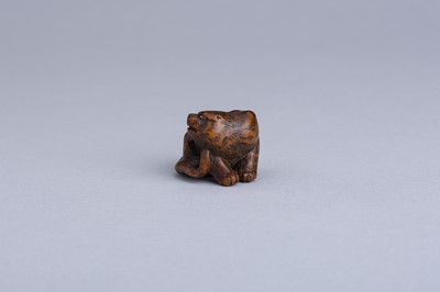 Lot 333 - MASANAO: A WOOD NETSUKE OF A SNARLING TIGER, EDO PERIOD