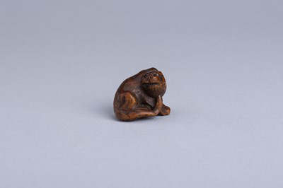 Lot 333 - MASANAO: A WOOD NETSUKE OF A SNARLING TIGER, EDO PERIOD