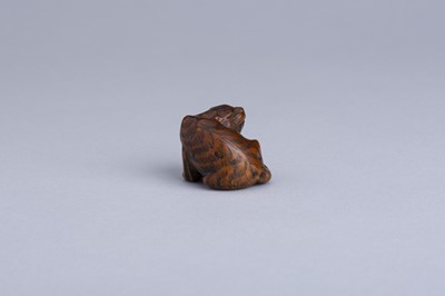 Lot 333 - MASANAO: A WOOD NETSUKE OF A SNARLING TIGER, EDO PERIOD