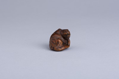 Lot 333 - MASANAO: A WOOD NETSUKE OF A SNARLING TIGER, EDO PERIOD