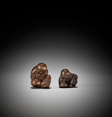 Lot 1449 - TADATOSHI: A SUPERB NAGOYA SCHOOL WOOD NETSUKE OF A SEATED SLEEPING SHOJO