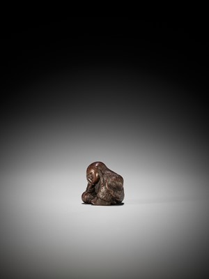 Lot 1449 - TADATOSHI: A SUPERB NAGOYA SCHOOL WOOD NETSUKE OF A SEATED SLEEPING SHOJO