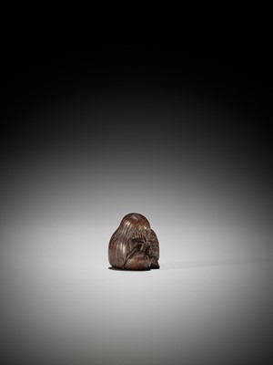 Lot 1449 - TADATOSHI: A SUPERB NAGOYA SCHOOL WOOD NETSUKE OF A SEATED SLEEPING SHOJO
