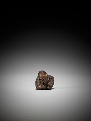 Lot 1449 - TADATOSHI: A SUPERB NAGOYA SCHOOL WOOD NETSUKE OF A SEATED SLEEPING SHOJO