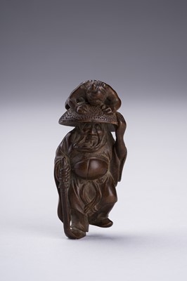 Lot 398 - A BOXWOOD NETSUKE OF SHOKI AND ONI
