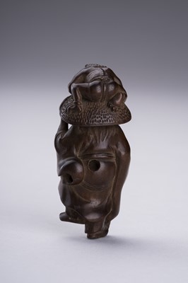 Lot 398 - A BOXWOOD NETSUKE OF SHOKI AND ONI