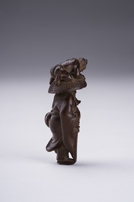 Lot 398 - A BOXWOOD NETSUKE OF SHOKI AND ONI