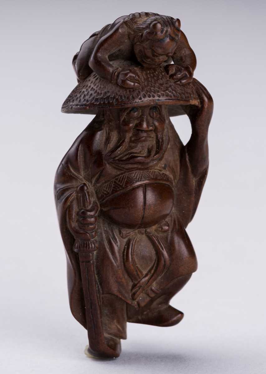 Lot 398 - A BOXWOOD NETSUKE OF SHOKI AND ONI