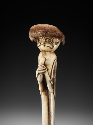 Lot 120 - A SUPERB STAG ANTLER OBI HASAMI NETSUKE OF A KAPPA WITH CUCUMBER, ATTRIBUTED TO KOKUSAI