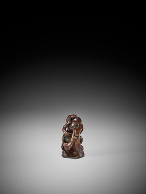 Lot 169 - SUKEYUKI: A FINE WOOD OKIMONO OF A SNAKE WINDING THROUGH A ROCK