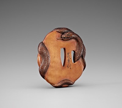 Lot 454 - YOSHIAKI: A RARE WOOD TSUBA DEPICTING A SNAKE