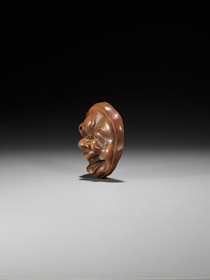 Lot 246 - A LARGE AND SUPERB WOOD MASK NETSUKE OF A GROTESQUELY GRIMACING MAN, ATTRIBUTED TO KOKEISAI SANSHO