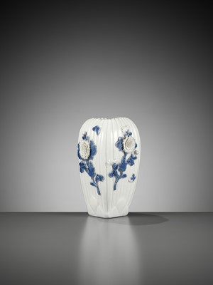 Lot 117 - A MOLDED AND CARVED HIRADO BLUE AND WHITE VASE WITH CHRYSANTHEMUMS AND BUTTERFLIES