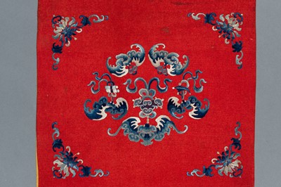 Lot 454 - AN EMBROIDERED RED GROUND WALL HANGING, QING