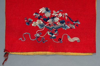 Lot 454 - AN EMBROIDERED RED GROUND WALL HANGING, QING