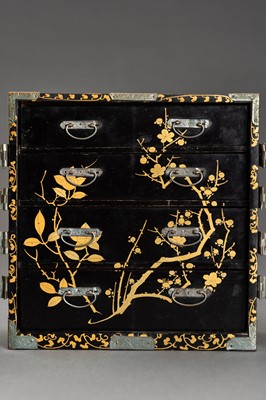 Lot 180 - A BLACK AND GOLD LACQUER MINIATURE CABINET