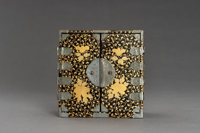 Lot 180 - A BLACK AND GOLD LACQUER MINIATURE CABINET