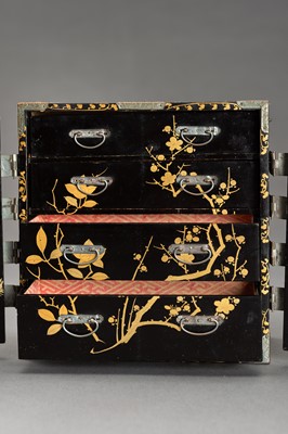 Lot 180 - A BLACK AND GOLD LACQUER MINIATURE CABINET