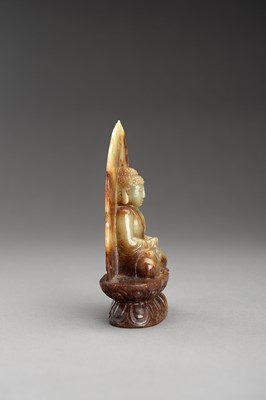 Lot 178 - A PALE CELADON AND RUSSET JADE FIGURE OF BUDDHA