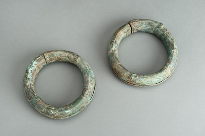 Lot 843 - A PAIR OF BRONZE ‘FROG’ RITUAL BANGLES, DONG SON CULTURE