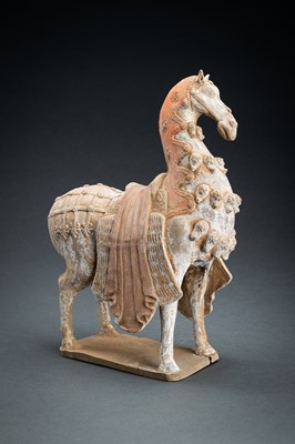 Lot 300 - A PAINTED NORTHERN WEI POTTERY FIGURE OF A CAPARISONED HORSE