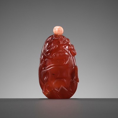 Lot 581 - A ‘DEER AND HORSE’ CARNELIAN SNUFF BOTTLE, QING DYNASTY